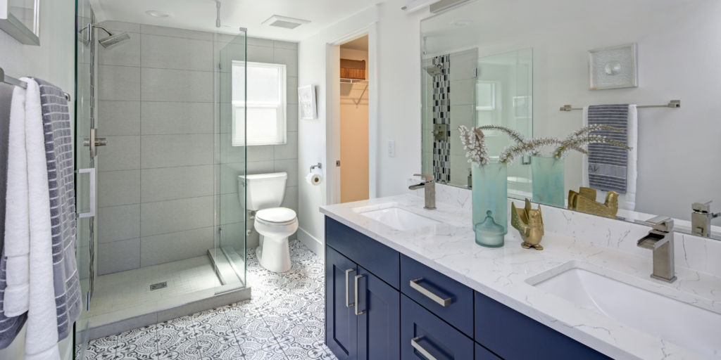 Modern Bathroom With Blue Vanity - 10 Home Renovations That Instantly Increase Your Home Value