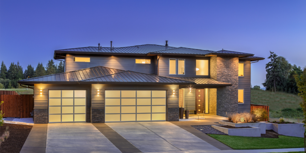 Modern Home At Dusk - How to Boost Property Value with the Right Garage Door Upgrades